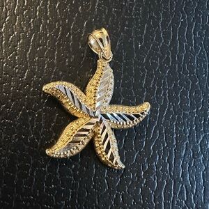 Gold and Silver Starfish Pendant. 14k yellow and white gold diamond cut texture.